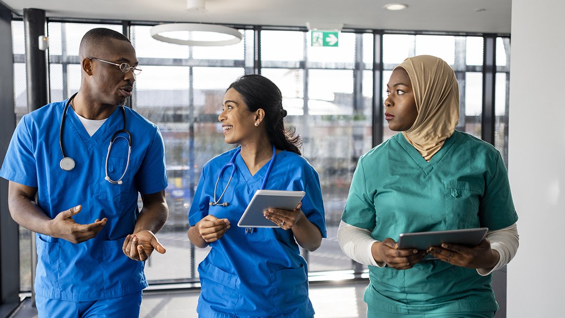 Medical Workers Walking through the Corridor